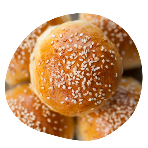 imagem circular com um pão de hamburguer americano e gergelim por cima 