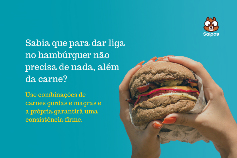 Imagem de um hambúrguer com carne, queijo, tomate, alface e picles, sendo segurado por duas mãos, promovendo a combinação de carnes gordas e magras para uma consistência firme.